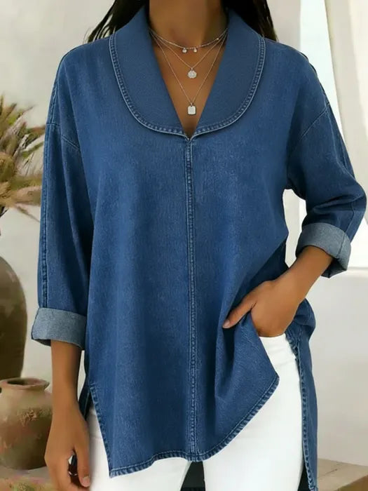 Woman wearing a blue retro denim top with shawl collar