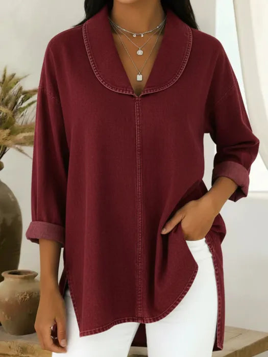 Woman wearing a wine red retro denim top with shawl collar